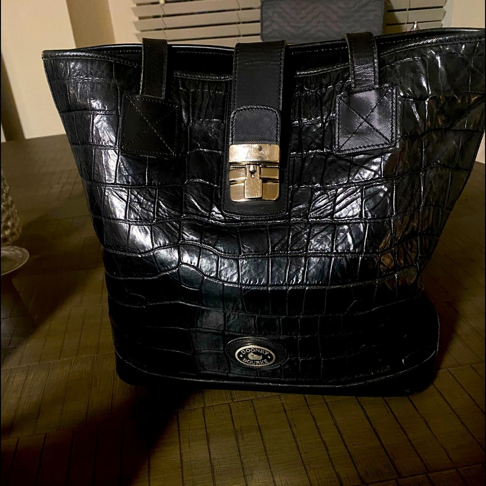 Dooney and Bourke black leather crossbody shoulder bag.
